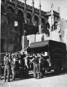 Men and women being served tea from the back of a van outside Inner Temple Hall