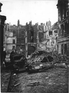 Car surrounded by destroyed buildings and rubble