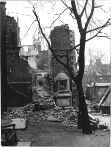 Goldsmith's Tomb under rubble and the Master's House behind