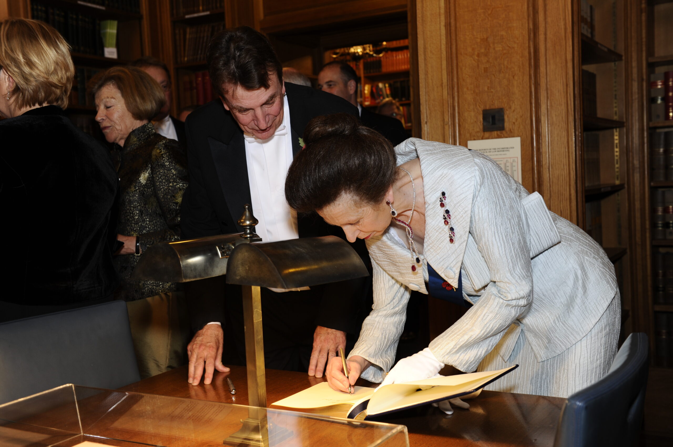 HRH The Princess Royal, The Royal Treasurer, signs the guest book while the Sub-Treasurer looks on, Grand Day, November 2011