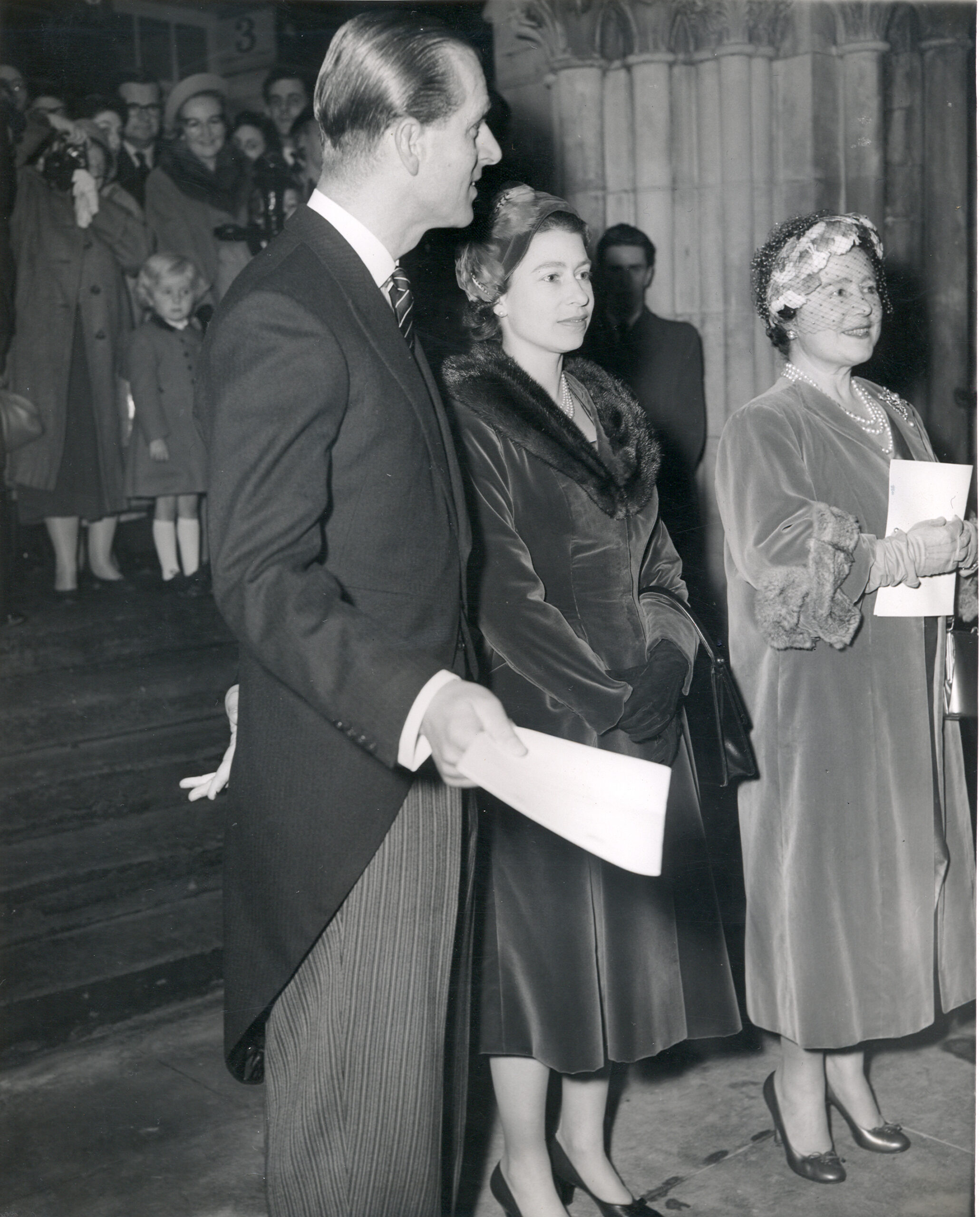 HRH The Duke of Edinburgh, HM The Queen and HM Queen Elizabeth, The Queen Mother in a line 1958