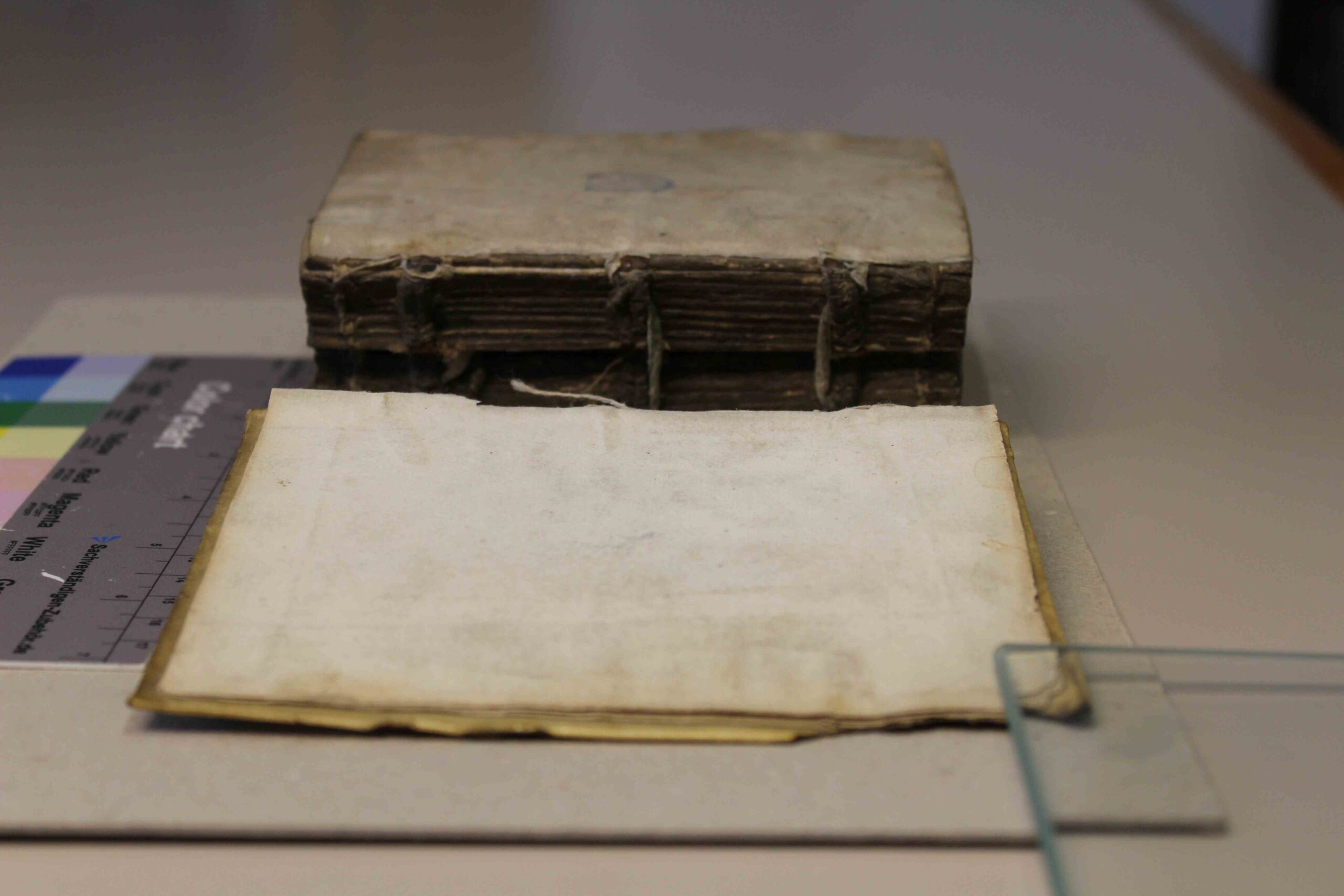 front cover of book coming away from the binding