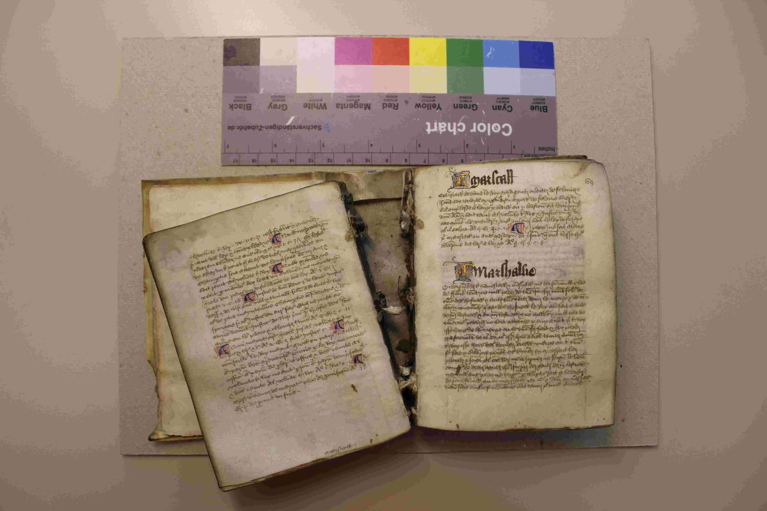 open book showing pages coming away from the central binding