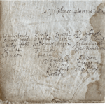 Handwritten names on an old tatty looking, stained page from the volume.