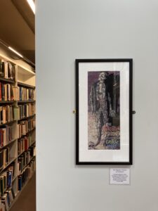 Embroidered framed picture of a skeleton hanging on a wall with text: The Forgotten Prisoner of Castelmore